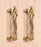 Golden brass door handle pair with peacock-and-feather engravings and side mounting
