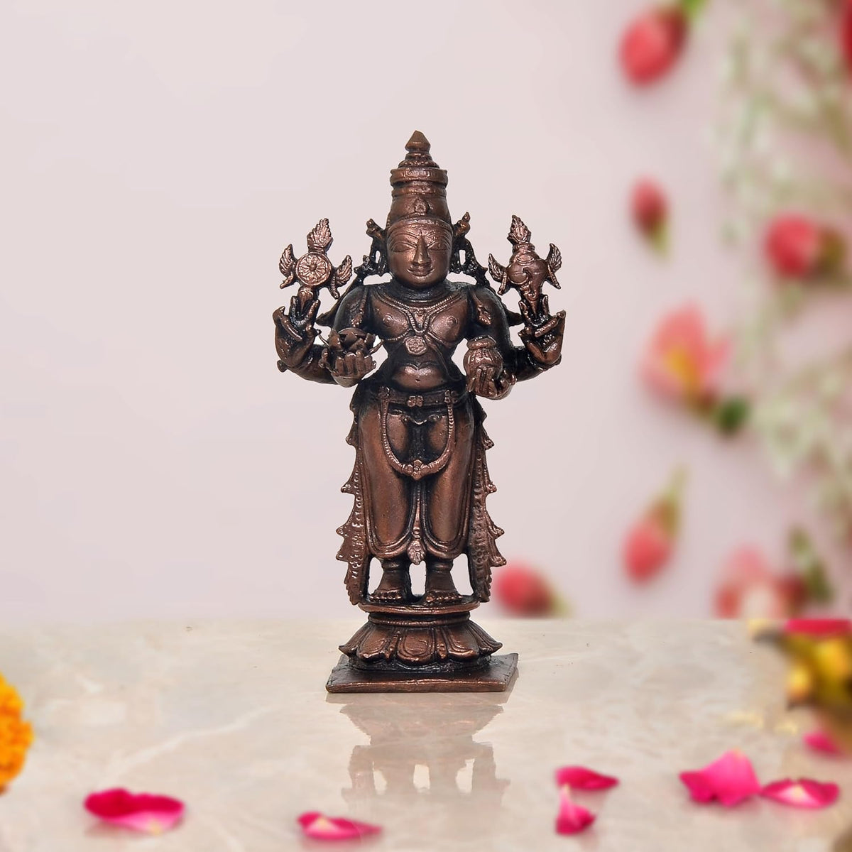 Copper Dhanvantari deity statue, four arms with raised hands, 4-inch height