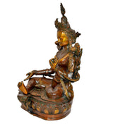 Tara Devi brass statue side view, seated pose, jeweled ornaments, flowered halo