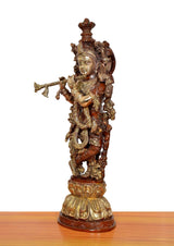 Krishna brass flute sculpture, angled side view with ornate back ornaments and flute raised