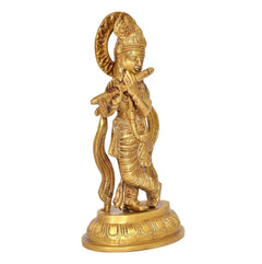 Brass Krishna figurine playing flute, side view with detailed draped jewelry and base