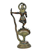 Brass Krishna statue dancing on Kaliya serpent, close profile, textured detailing