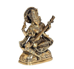Brass Maa Saraswati statue, three-quarter view, veena and raised hand, seated