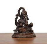 Lord Ganesha murti angled view, multiple arms and ornate pedestal base