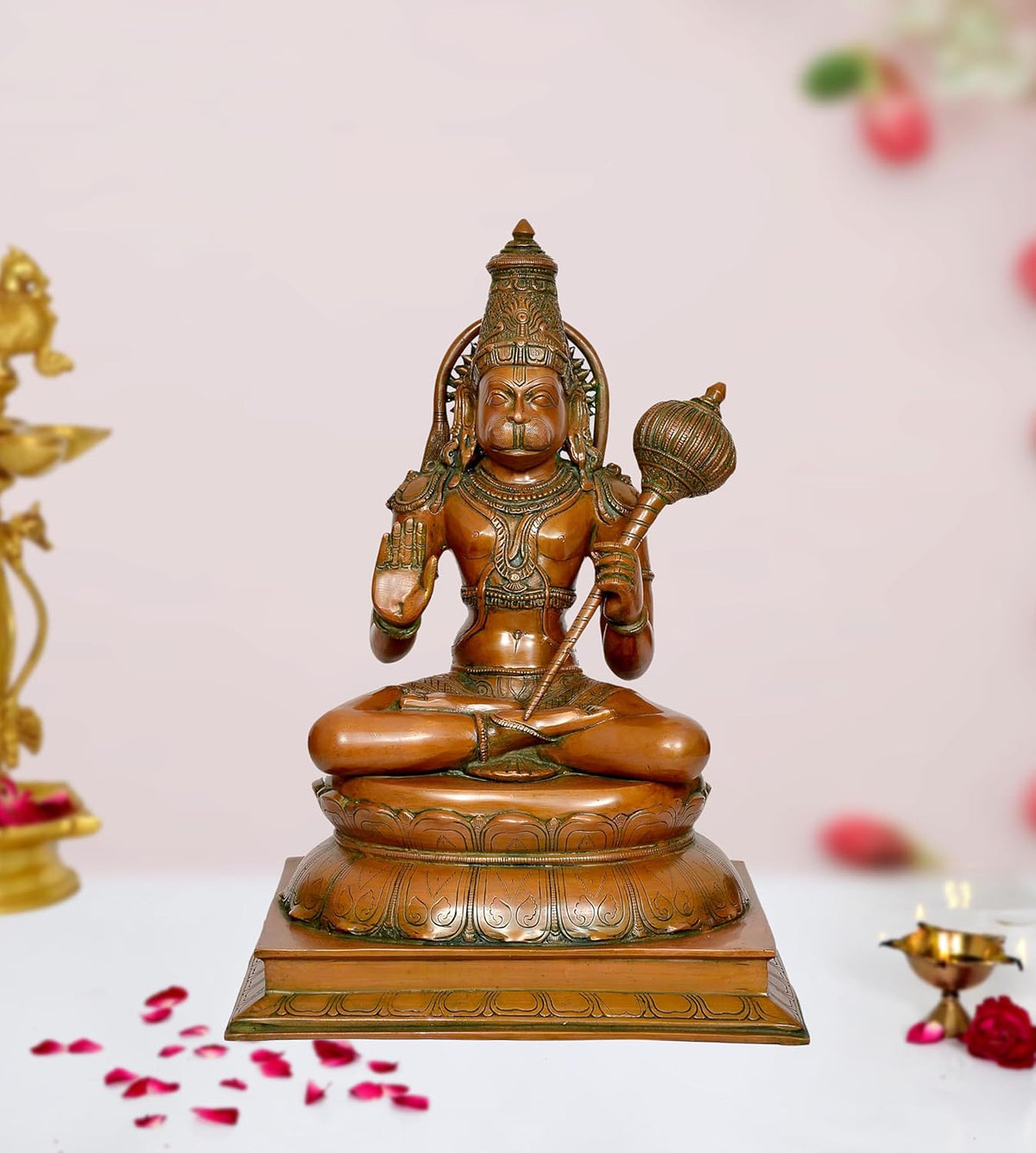 Brass Hanuman idol seated with mace and blessing pose, ornate engraved base
