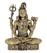 Close-up of brass Lord Shiva statue with trident and seated posture, 3 inch