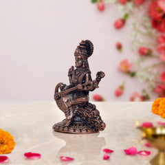 Copper Maa Saraswati idol, side view holding veena, detailed base, 3 inch
