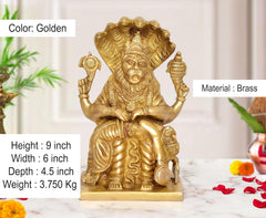 Golden brass Narasimha statue, seated pose with detailed armor and weapons
