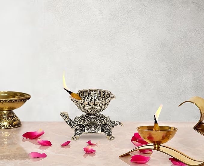 Brass tortoise diya oil lamp with ornate bowl and flame, height 2 inches