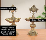Brass oil lamp stand with five shallow diya bowls and Vishnu-style finial