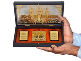 Hand holding open Lord Ram Darbar gift box showing gold-plated darbar and two black scripture cards