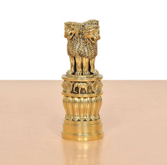 Bronze-toned Ashoka Stambh with lion figures on top and fluted base sections.