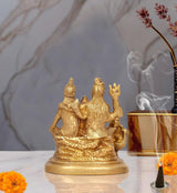 Brass Shiva Parivar idol statue, back three-quarter view with figures and ornate clothing