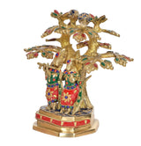 Side view of brass Radha Krishna under-tree flute idol with painted attire