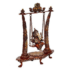 Brass Ganesha swing idol angled view, four pillars and hanging frame