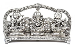 Front view: silver metal Ganesha, Lakshmi & Saraswati sculpture, detailed halos