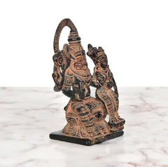 Brass Lakshmi-Narasimha idol (6 inch), angled view with detailed torso and halo
