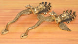 Brass Naga Kanya door handles pair, close-up of winged serpent bodies and levers