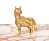 Brass Kamdhenu cow figurine, golden finish, front-right profile with patterned body
