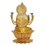 Rear view of brass Lakshmi statue, circular halo emblem over lotus pedestal