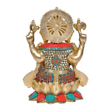 Rear view brass Ganesha statue with halo-like arch and colorful jeweled waist details