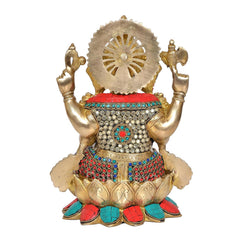 Rear view brass Ganesha statue with halo-like arch and colorful jeweled waist details