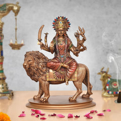 Durga Maa resin idol on lion, jeweled crown, four arms holding symbols