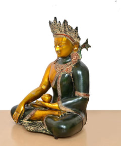 Side view of seated Buddha statue with bhumisparsha mudra and ornate crown detailing