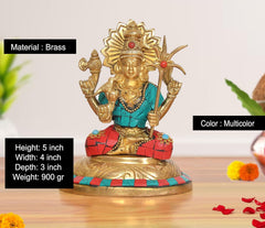 Brass goddess statue, multicolor finish; teal bodice and red skirt with ornate golden details.
