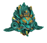 Teal resin Kirtimukha wall hanging with gold crown, flame details and trident-like tip
