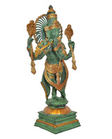 Reverse view of green brass Krishna playing flute, fan-shaped halo behind head