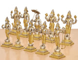 Golden brass Dashavatara figurines close-up, umbrella detail and holding weapons