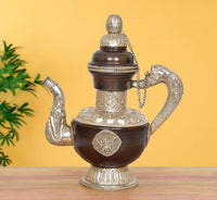 Himalayan brass teapot showpiece with dark brown body, arched handle, and ornate lid