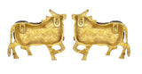Brass cow statues pair, rear view showing tails and decorated backs