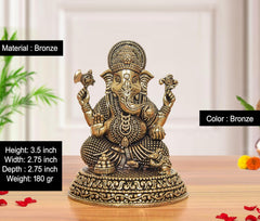 Brass Ganesh statue, detailed beaded robe and raised hands; bronze finish