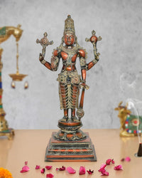 Brass Lord Vishnu standing idol with four arms, ornate crown and painted details