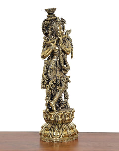 Lord Krishna brass sculpture statue, angled view showing patterned armor and base