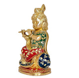 Krishna brass shank idol seated, profile view, ornate multicolor clothing and flute