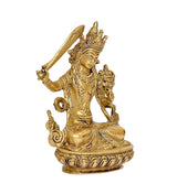 Brass Manjushree statue three-quarter view, raised arm, ornate robe and headdress