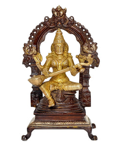 Seated Saraswati brass idol facing forward, arched backrest with detailed carvings