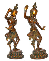 Brass dancing Shiva and Parvati figurines, front-left poses with raised right hands and garlands