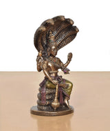 Resin Vishnu figurine seated with two raised arms on Sheshnag base, gold finish
