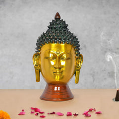 Gold and dark Buddha head wall hanging with detailed beaded hair and carved eyes