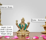 Brass Lord Bholenath sculpture, seated with teal garment and multicolor accents