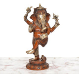 Dancing Ganesha brass idol with four arms, golden head ornaments, standing on base