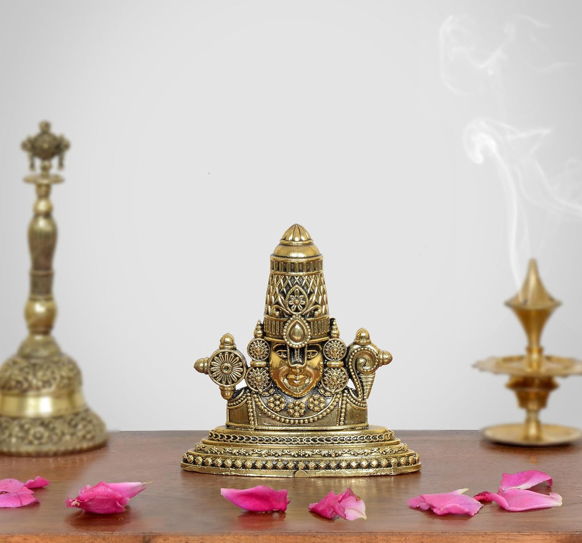 Tirupati Bala Ji brass face showpiece with detailed crown, front view on base