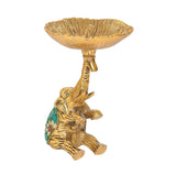 Golden metal elephant dry fruit bowl showpiece, raised legs, fluted tray top