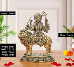 Bronze 3 inch Durga Maa figurine on a lion, detailed jewelry and raised weapons