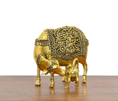 Golden brass cow figurine with calf, back view with decorative filigree panel