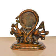 Back view of brass Panchmukhi Hanuman idol, textured halo and seated multi-armed body